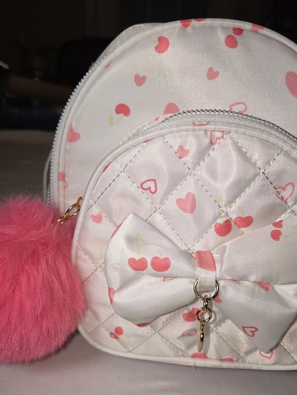 Under One Sky White & Pink Heart Crossbody Bag with Bow Accent And Pink Pom Pom